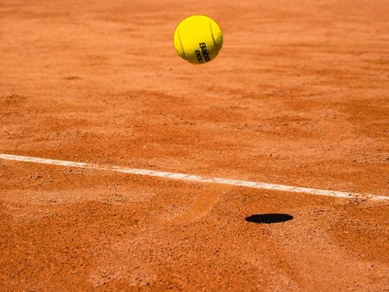 A tennis ball hitting the court at  Falkensteiner Hotel Iadera