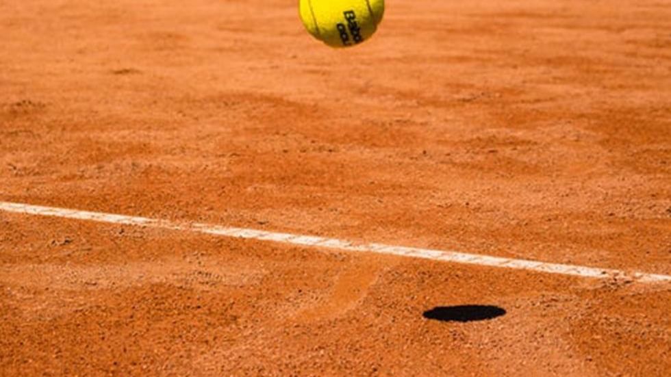 A tennis ball hitting the court at  Falkensteiner Hotel Iadera