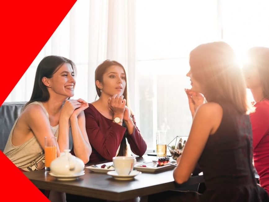 Group of ladies sitting in a cafe table with drinks at Imperial Lexis Kuala Lumpur