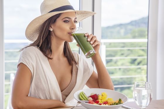 Woman enjoying a juice at Retreat Costa Rica