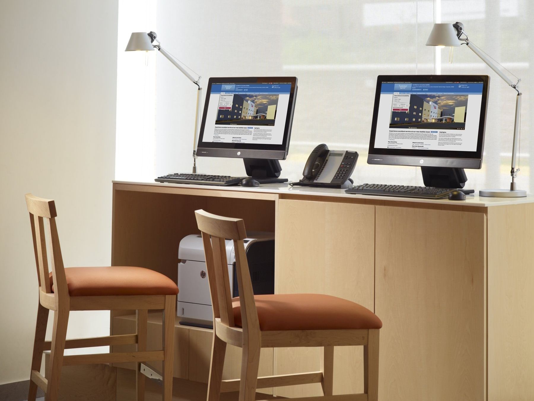 Close-up of 2 computers in a Business Center at One Hotels