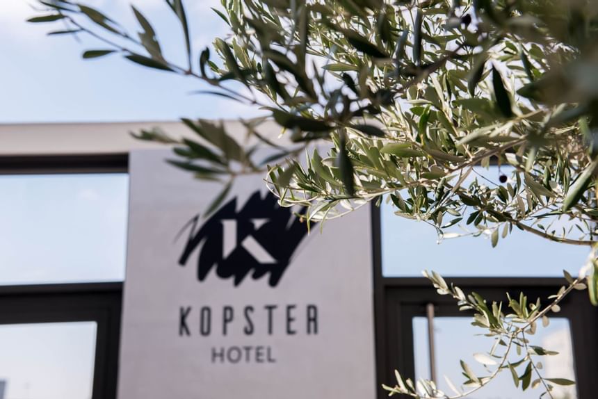 Exterior view of the entrance sign of Kopster Hotel 