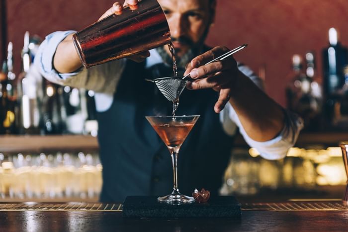 A bartender preparing a cocktail at Sunseeker Resort