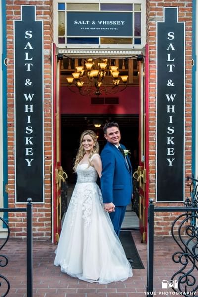 Bride & groom at salt & whiskey bar in Horton Grand Hotel