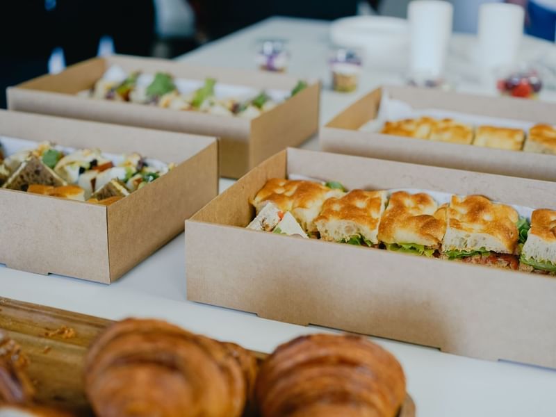 Pastries served in boxes at Bacar Pullman Sydney Olympic Park