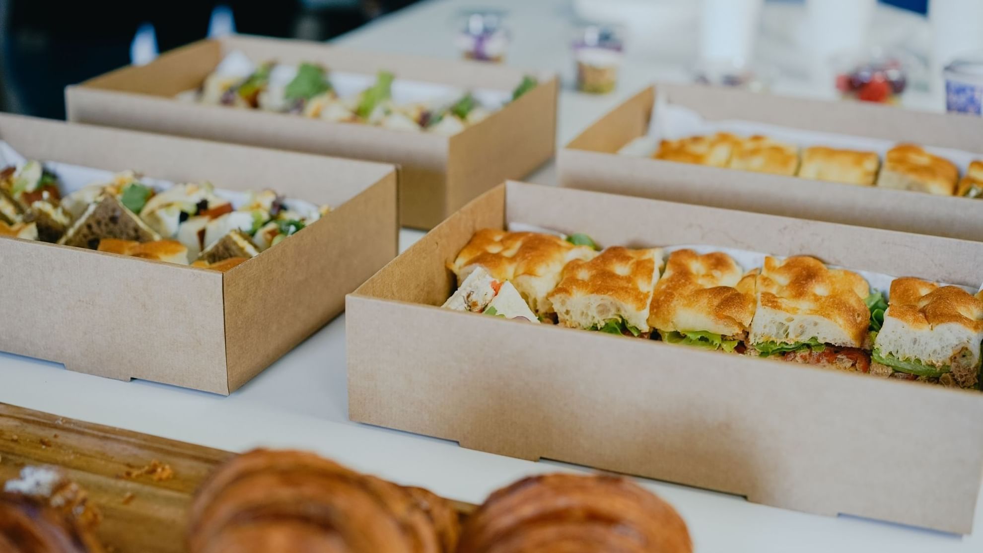 Pastries served in boxes at Bacar Pullman Sydney Olympic Park