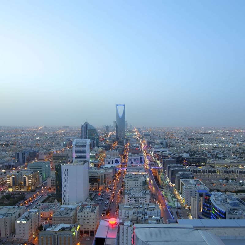 Aerial view of Riyadh from the Warwick Hotels and Resorts, showcasing city lights and the iconic King Abdulaziz Center