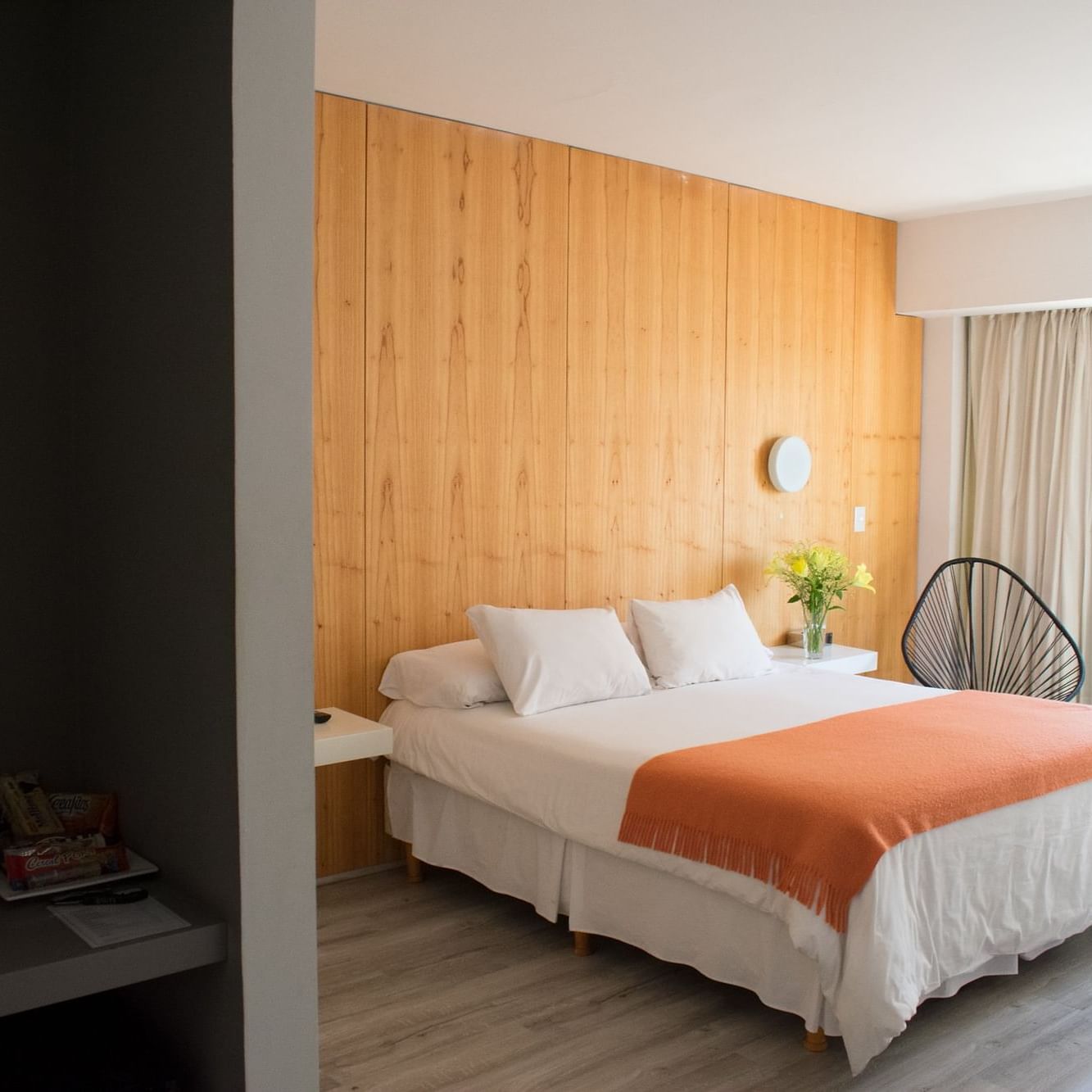 Queen bed in a spacious room at DecO Recoleta Hotel