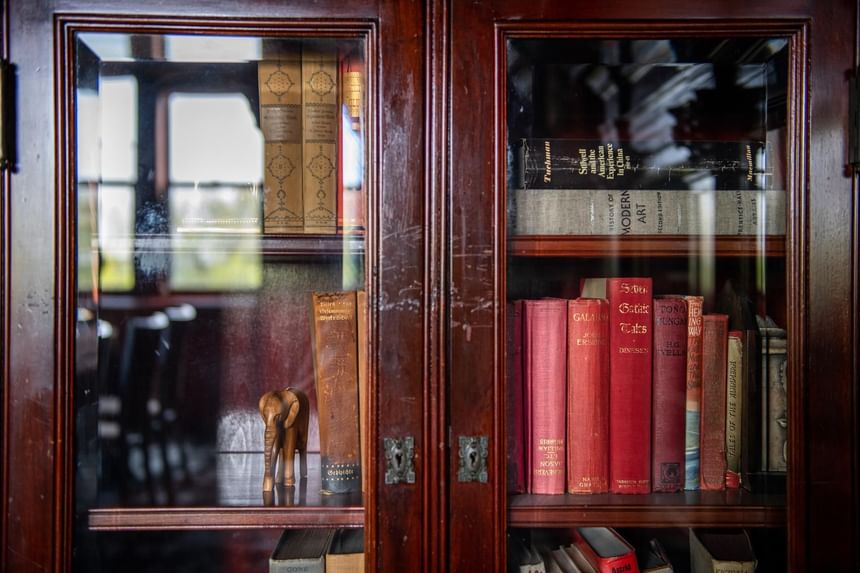 Books arranged in the cupboard at Castle Hotel and Spa