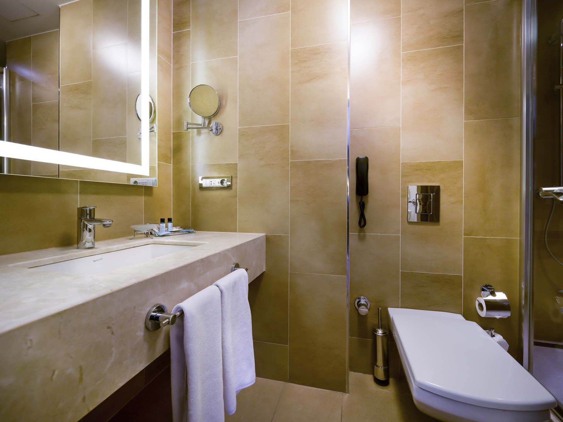 Bathroom interior with mirror and vessel sink in the Superior Room at Titanic Comfort Sisli