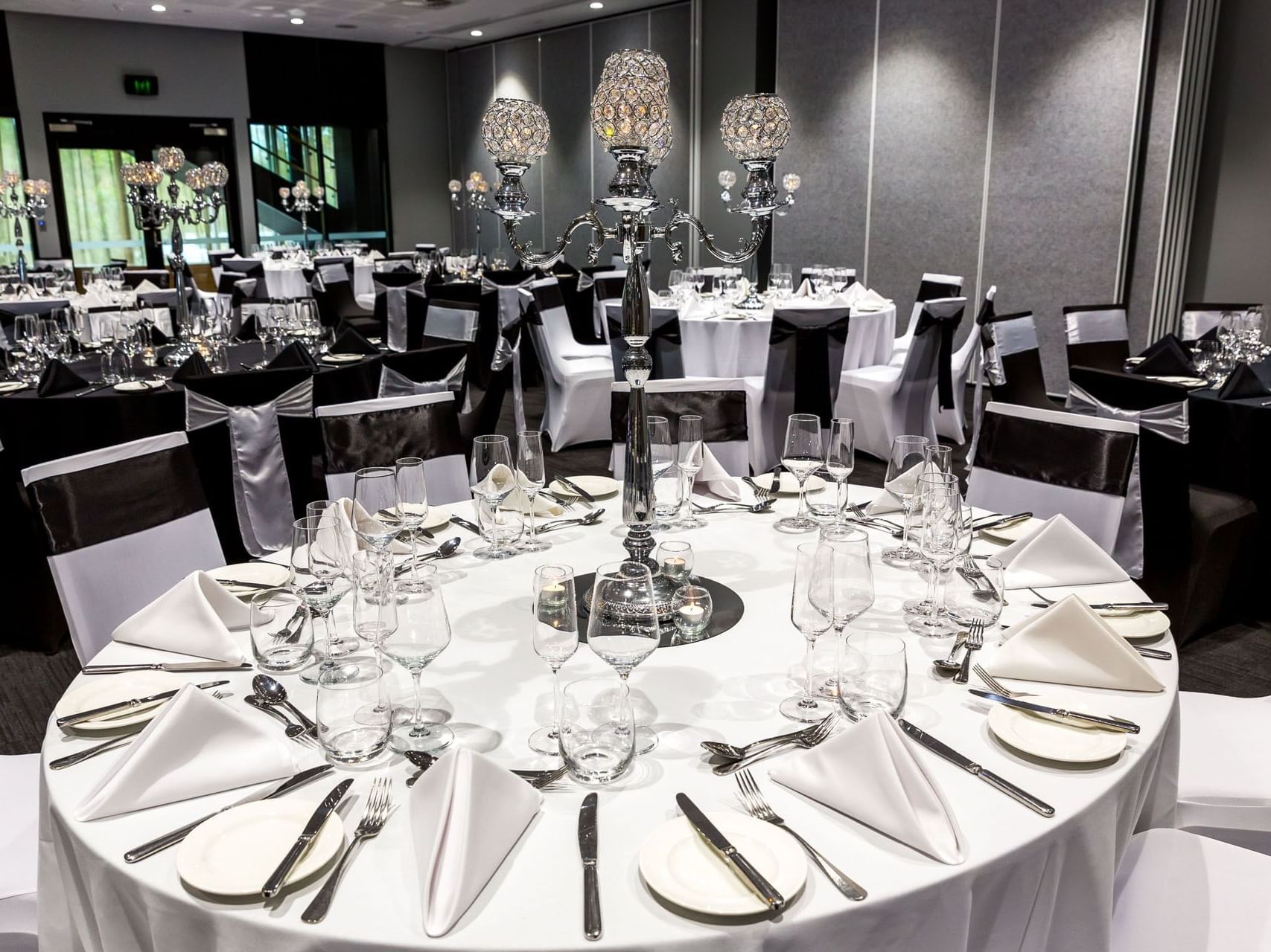 Banquet table set-up with fancy candle holders in Chancellor 6 at Grand Chancellor Brisbane