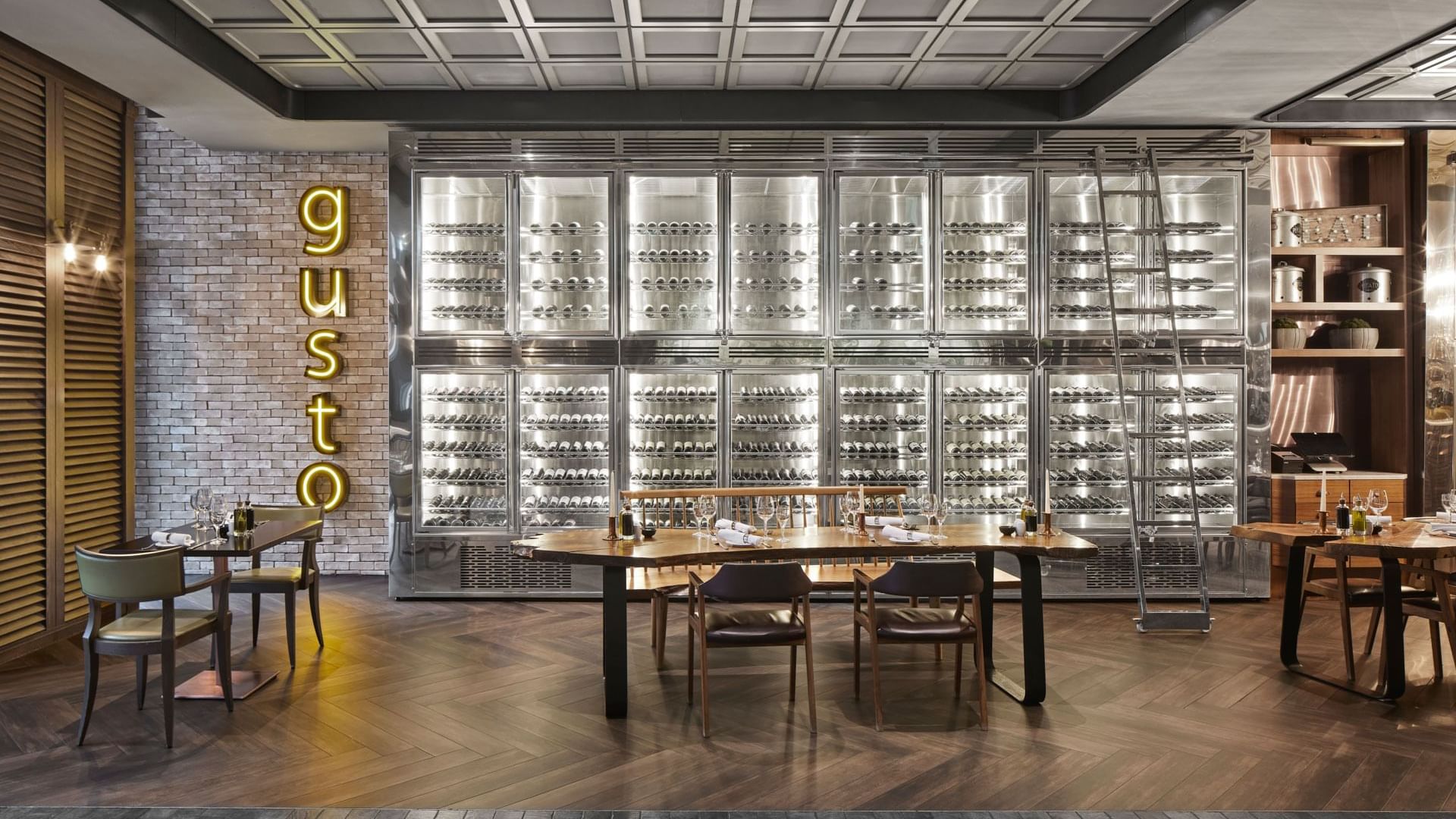 Gusto' sign, wall-to-wall wine refrigerators in Pascarella Restaurant at Titanic Chaussee Berlin