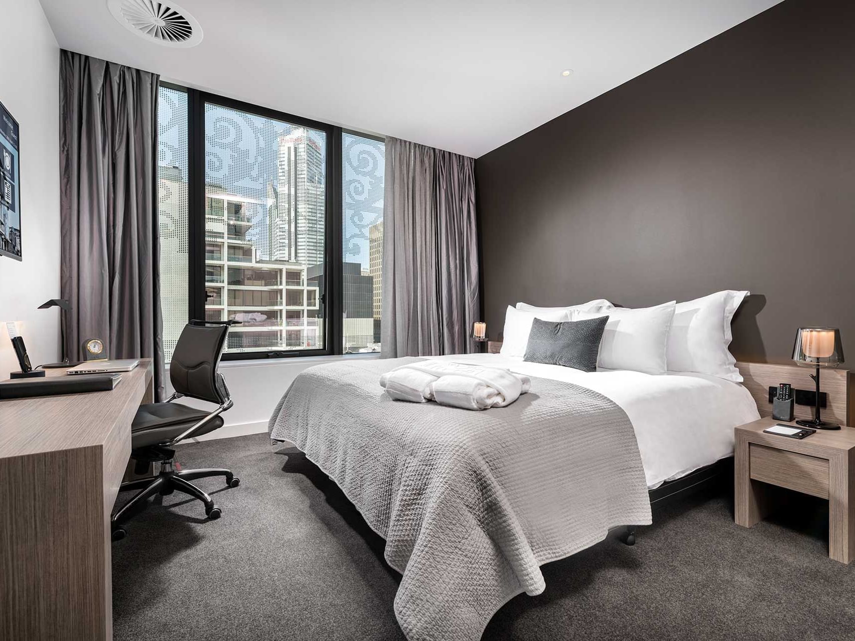 King bed and work area in Contemporary Room with city view at Melbourne Hotel Perth