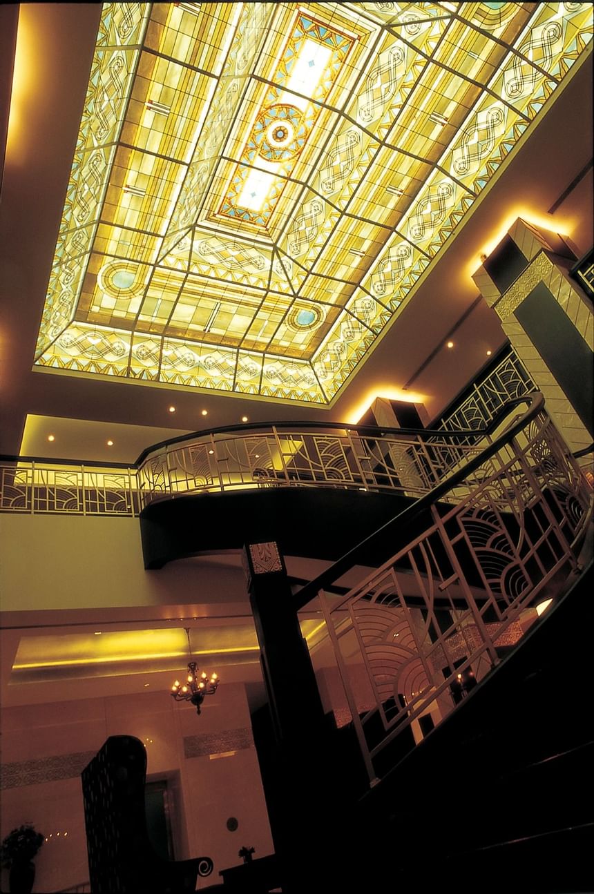 Ceiling art & the massive staircases at Yangtze Boutique Hotel