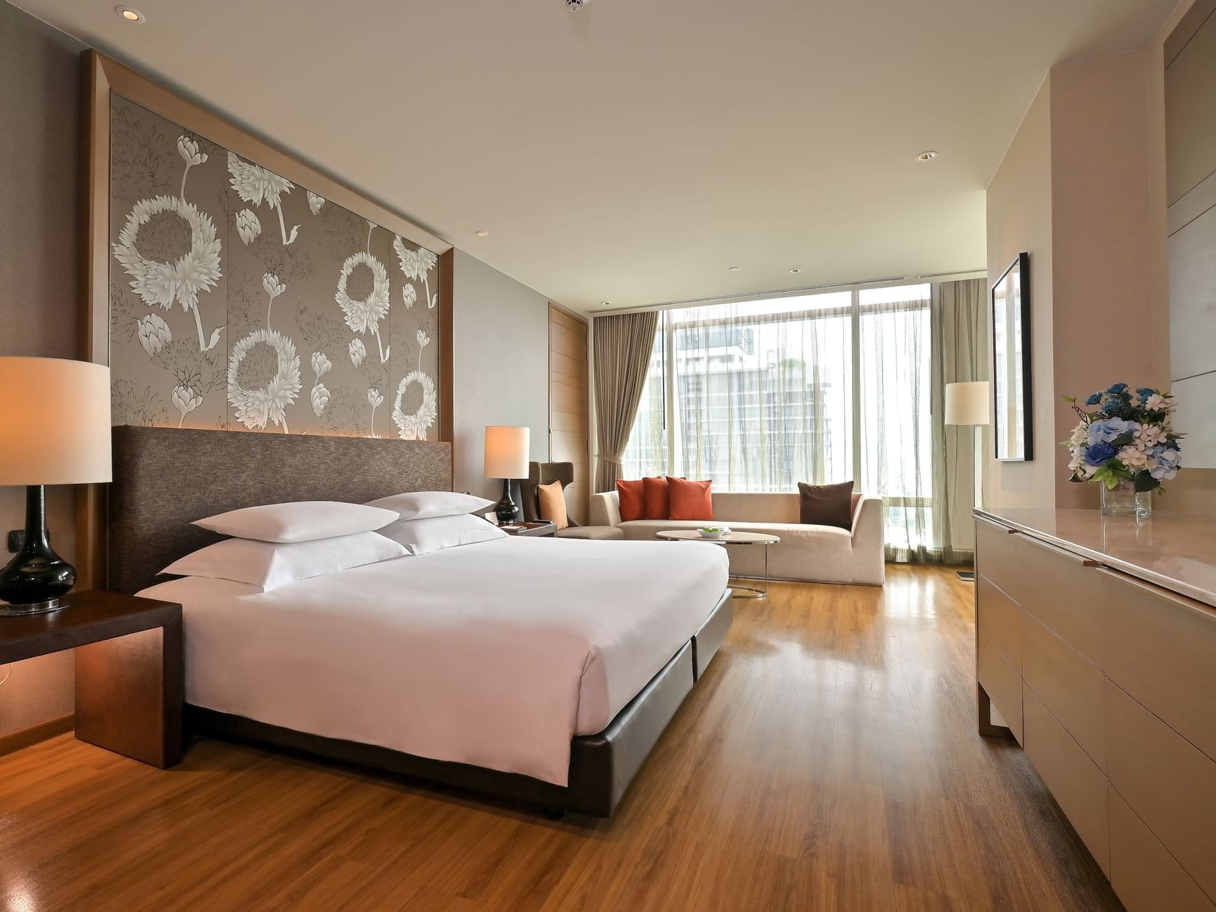 Bed with sofa in Premium Deluxe Room with city view at Eastin Grand Hotel Sathorn