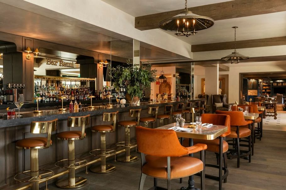 Bar Remi, Uptown Park, Houston restaurants with a wooden bar, leather seating, and warm lighting at Granduca Houston