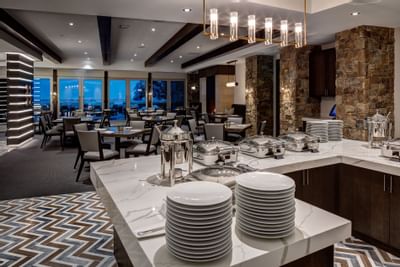 The 7880 Club buffet spread with glassware arranged at Stein Eriksen Residences