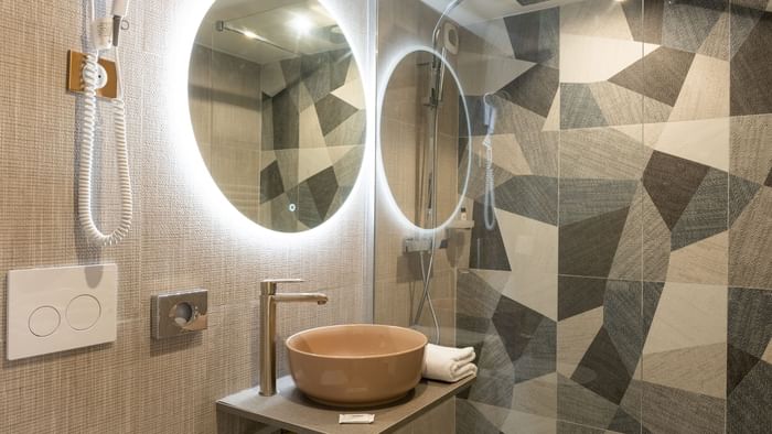 Bathroom vanity in bedrooms at Hotel Rennes South Chantepie