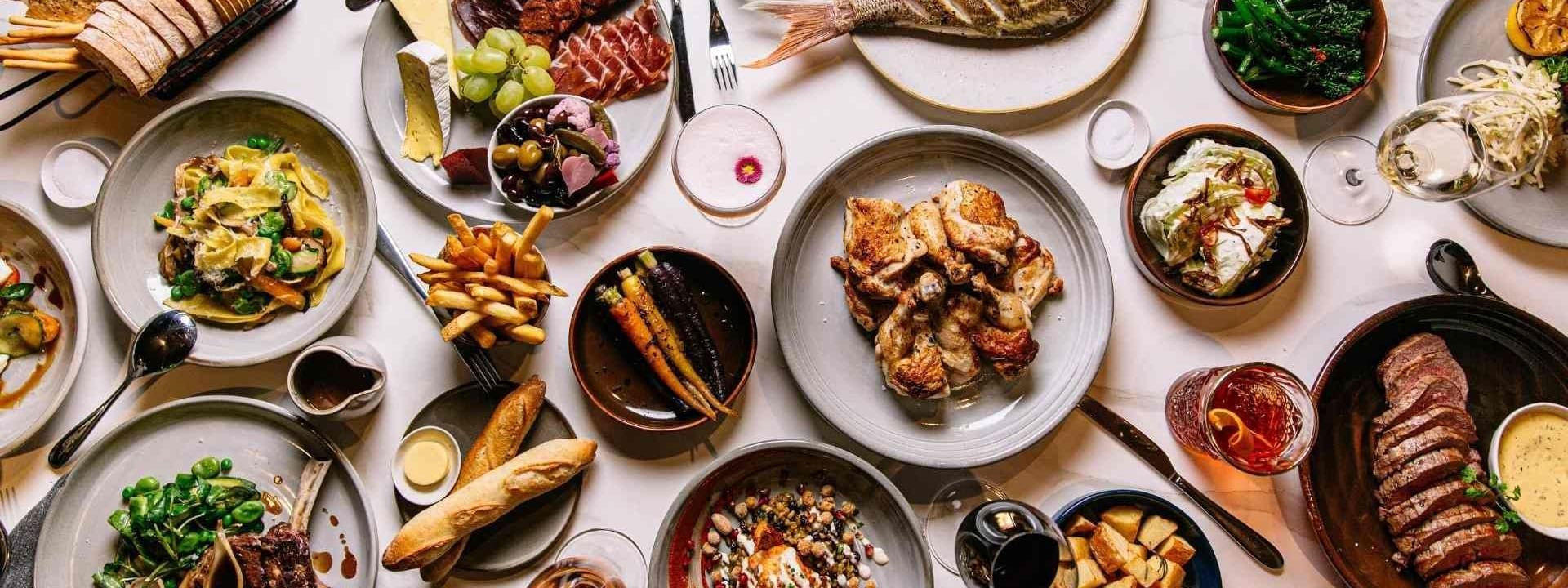 Spread of dishes in Eva's restaurant at Pullman Melbourne City