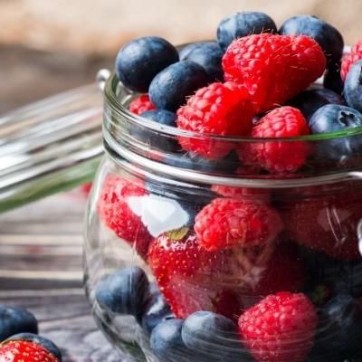 mix of strawberries, blueberries, raspberries in a jar