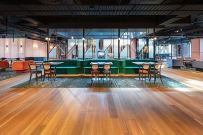 Lobby lounge area with wooden interior at Amora Hotel Melbourne