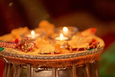 small table with south asian décor pieces and tea candles