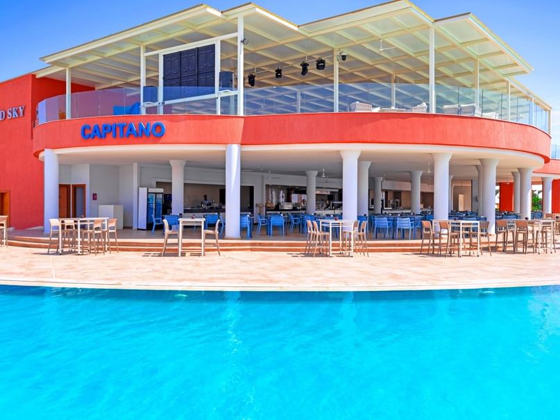 Capitano Bar with outdoor seating and pool at Pickalbatros Laguna Vista Hotel in South Sinai Governorate.