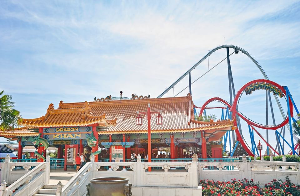 A Chinese building with two roller coasters in Portaventura Caribe Aquatic Park near Harborside Hotel Salou