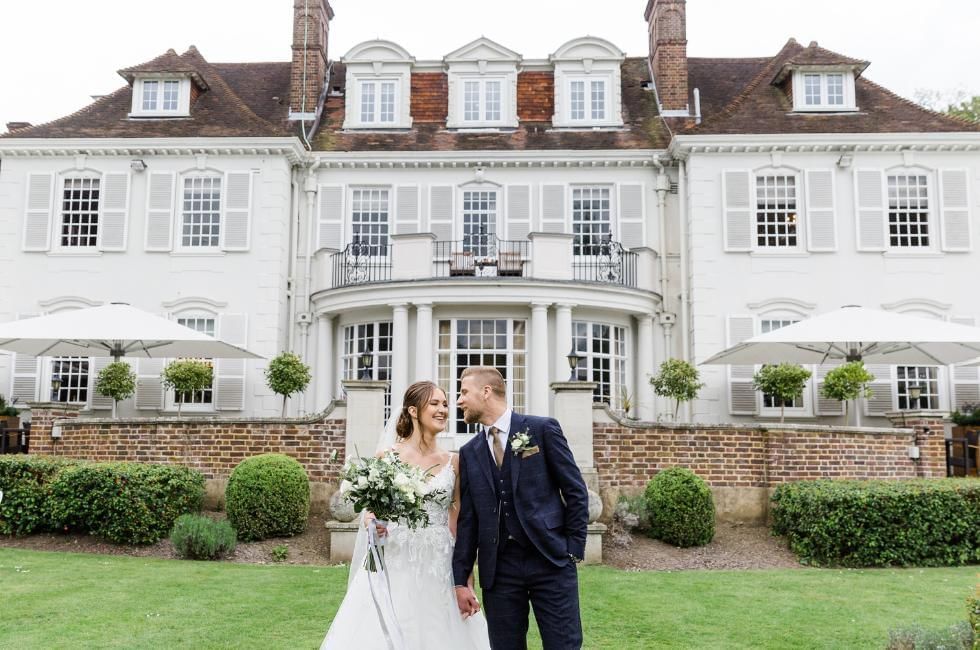couple outside of gorse hill wedding venue in woking