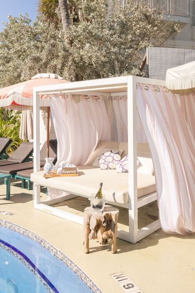 Cabana & sunbeds next to the pool area at The Savoy Hotel & Beach Club
