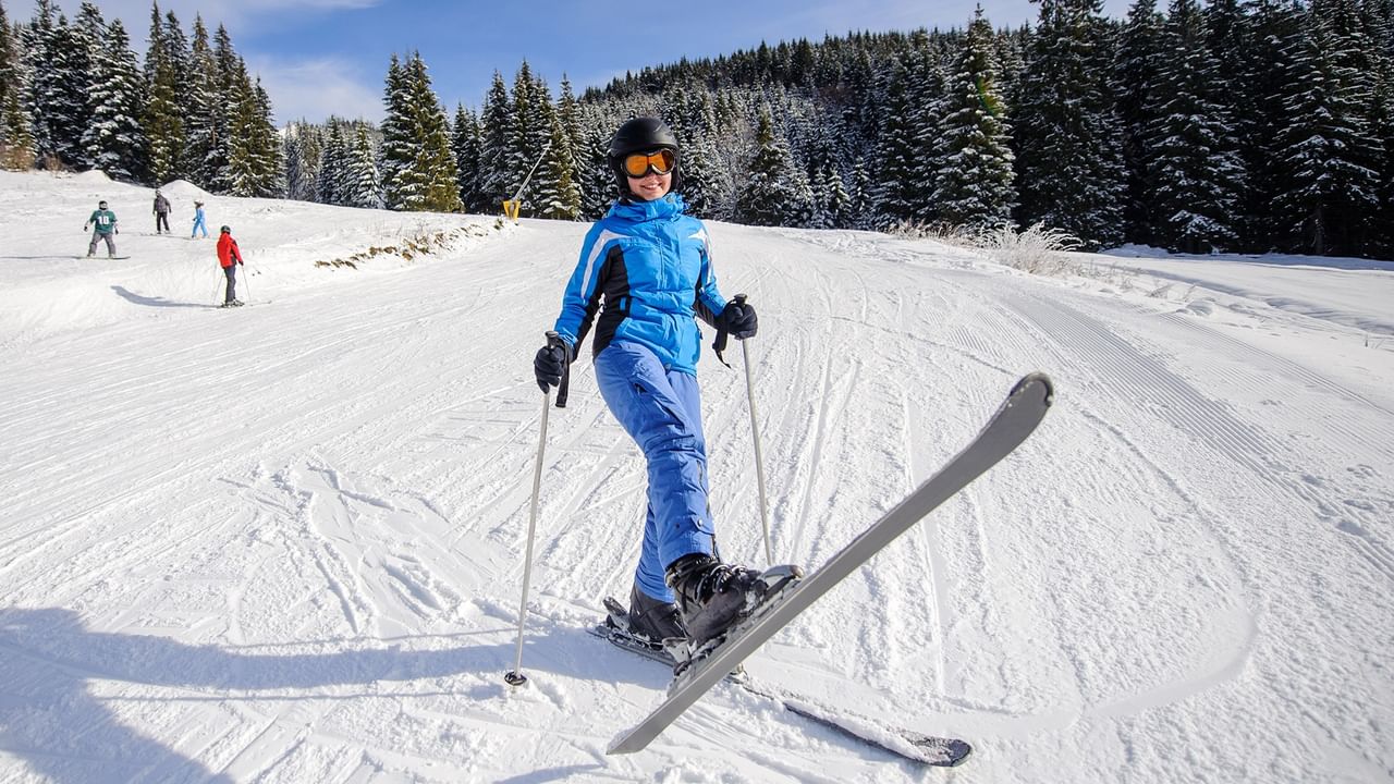Female skier on a snowy ski slope