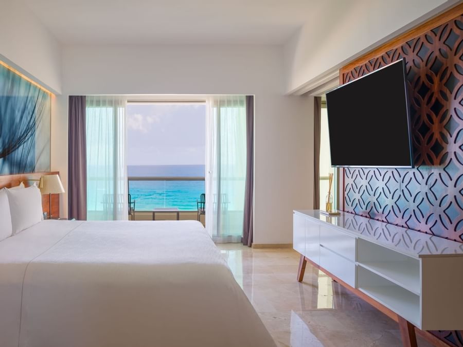 King bed, TV of Viento Suite with ocean view at the Live Aqua