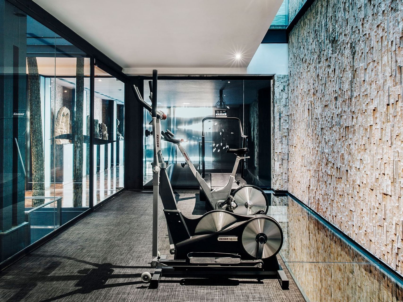 Exercise machines in a Fitness center at Barcelona Apartment