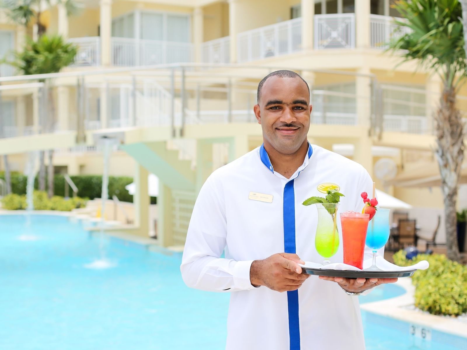 A Butler delivering drinks at Windsong Resort On The Reef
