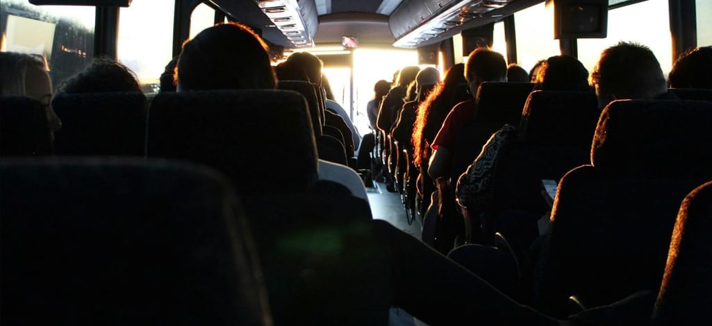 A travel group rides a bus together to Canmore.