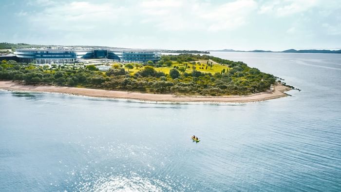 Aerial view of Falkensteiner Hotel & Spa Iadera surrounded by the ocean