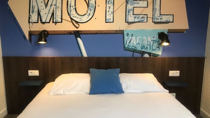 Interior of motel double bedroom at Hotel au chene vert