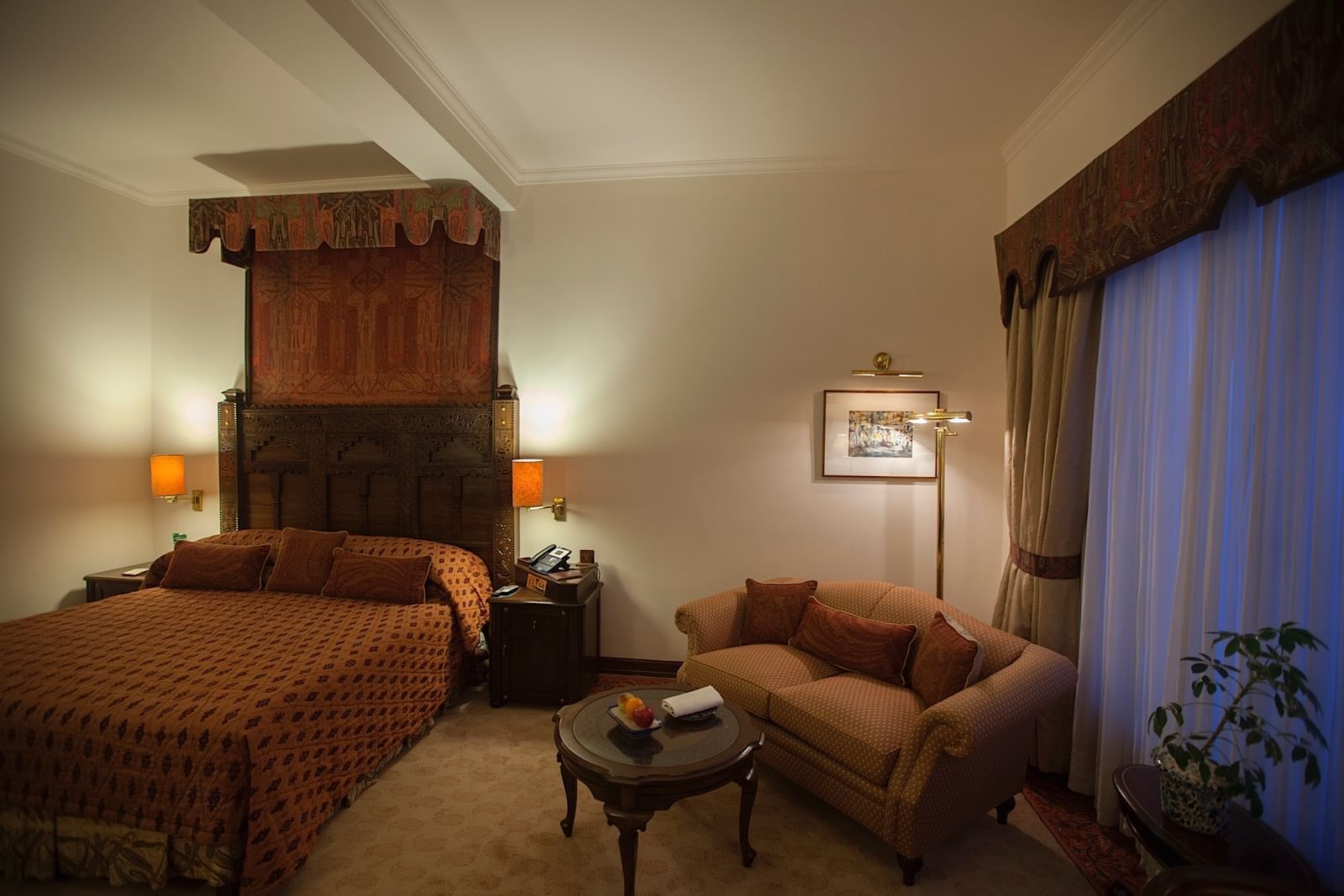 Bed & furniture in Deluxe Room at Islamabad Serena Hotel