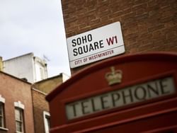Close up on Soho Square W1 name board near St. Giles London