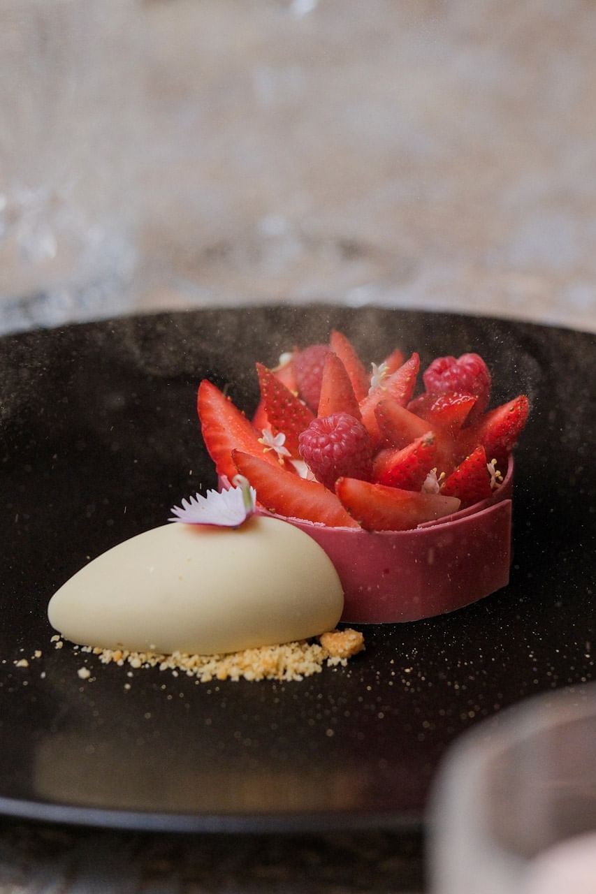 Close-up of white chocolate parfait with raspberry served at Park Hyatt Saigon