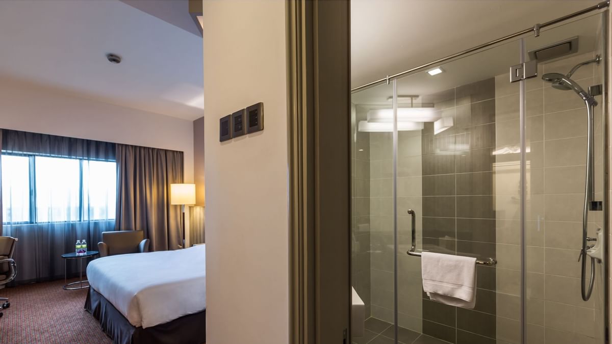 1 Bedroom Pool Villa with a glass-enclosed shower in the bathroom and a bed at Sunway Resort