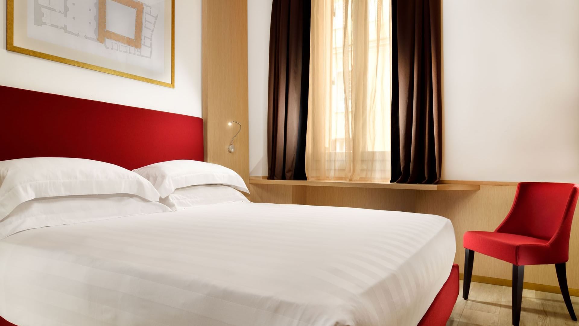 Well-arranged comfy bed with pillows in Classic Room at Babuino 181