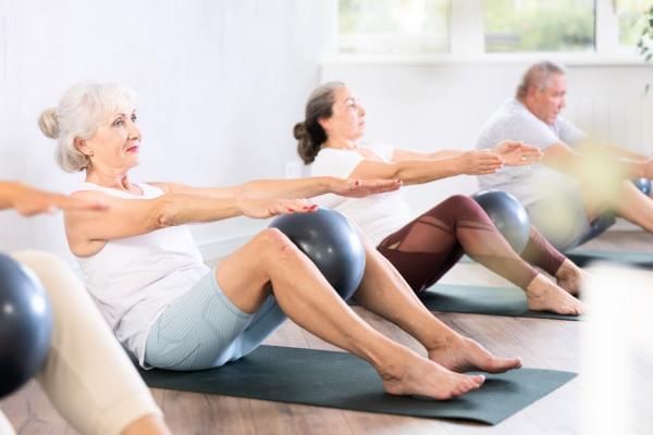 Pilates class engaging in a group workout