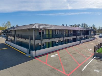 Modern grey hotel facade with metal roof and red parking lines in one of the hotels Centralia at The Varsity South