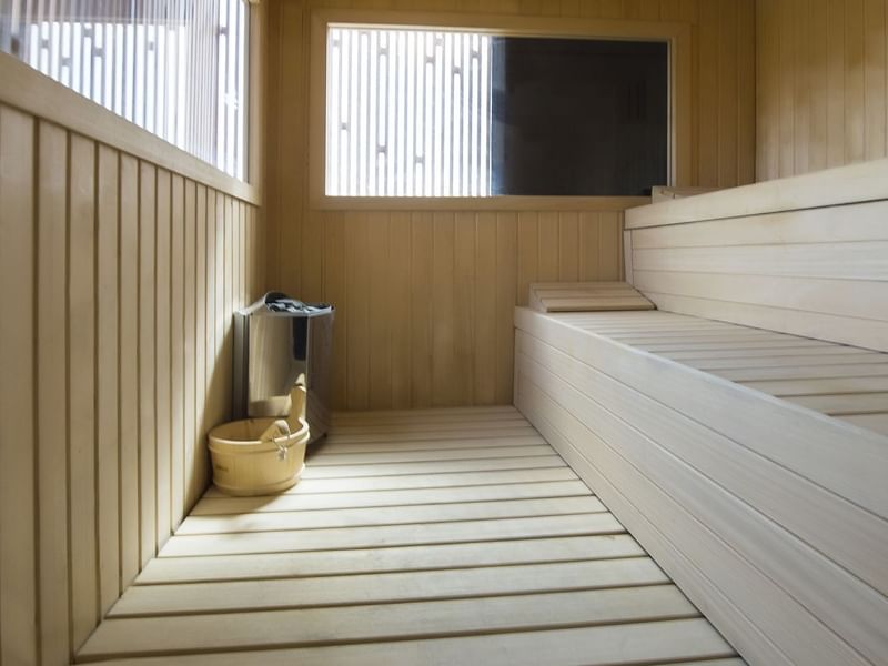 Sauna room interior with wooden stairs at Live Aqua Resorts and Residence Club
