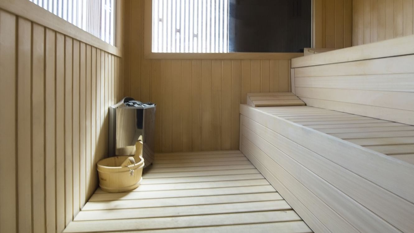 Sauna room interior with wooden stairs at Live Aqua Resorts and Residence Club