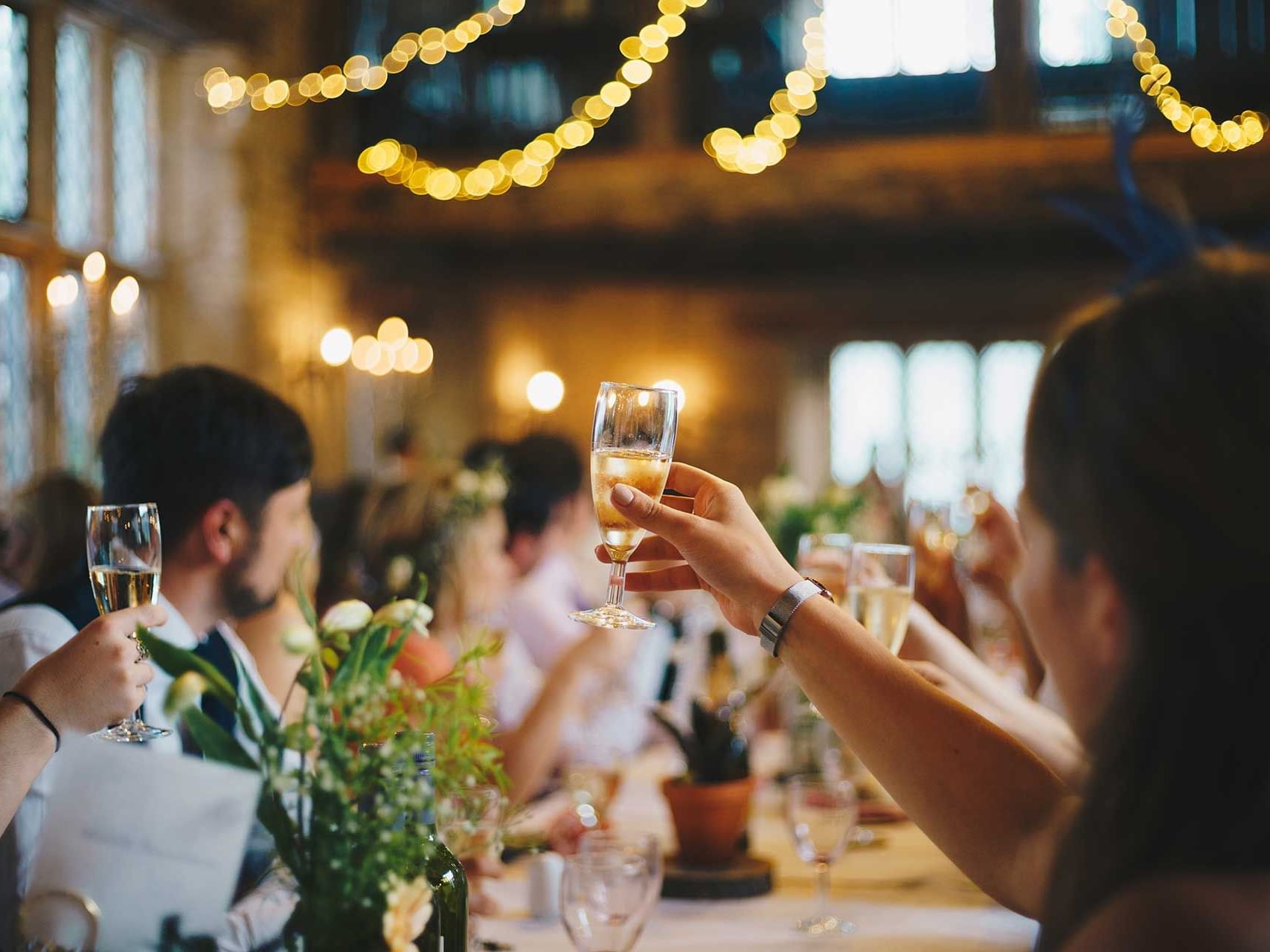 People toasting wine glasses at an Event at Discovery Samal