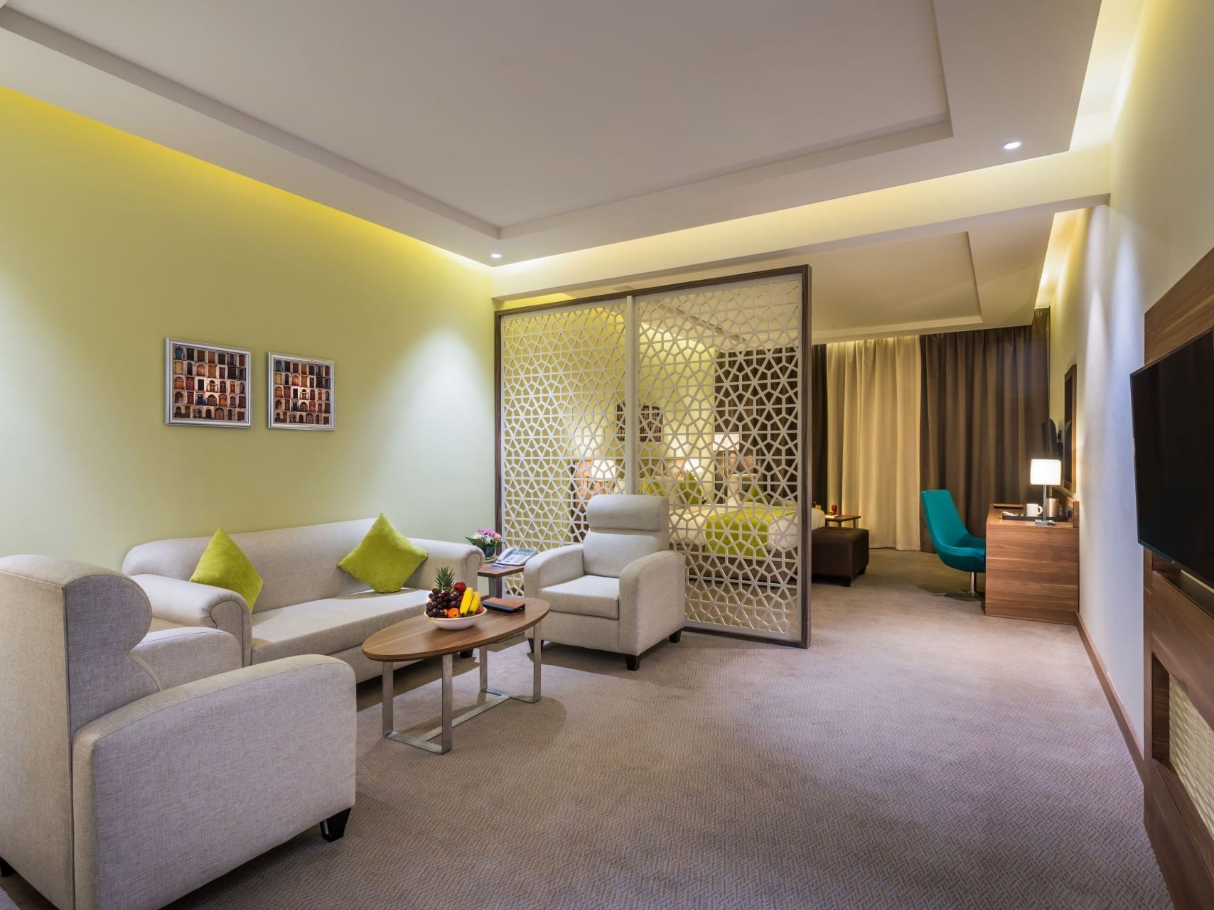 Interior of Executive suite with a king bed at Mena Hotel Tabuk