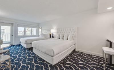 Interior of one of our Signature Queen Cape May hotel rooms with 2 Queen beds
