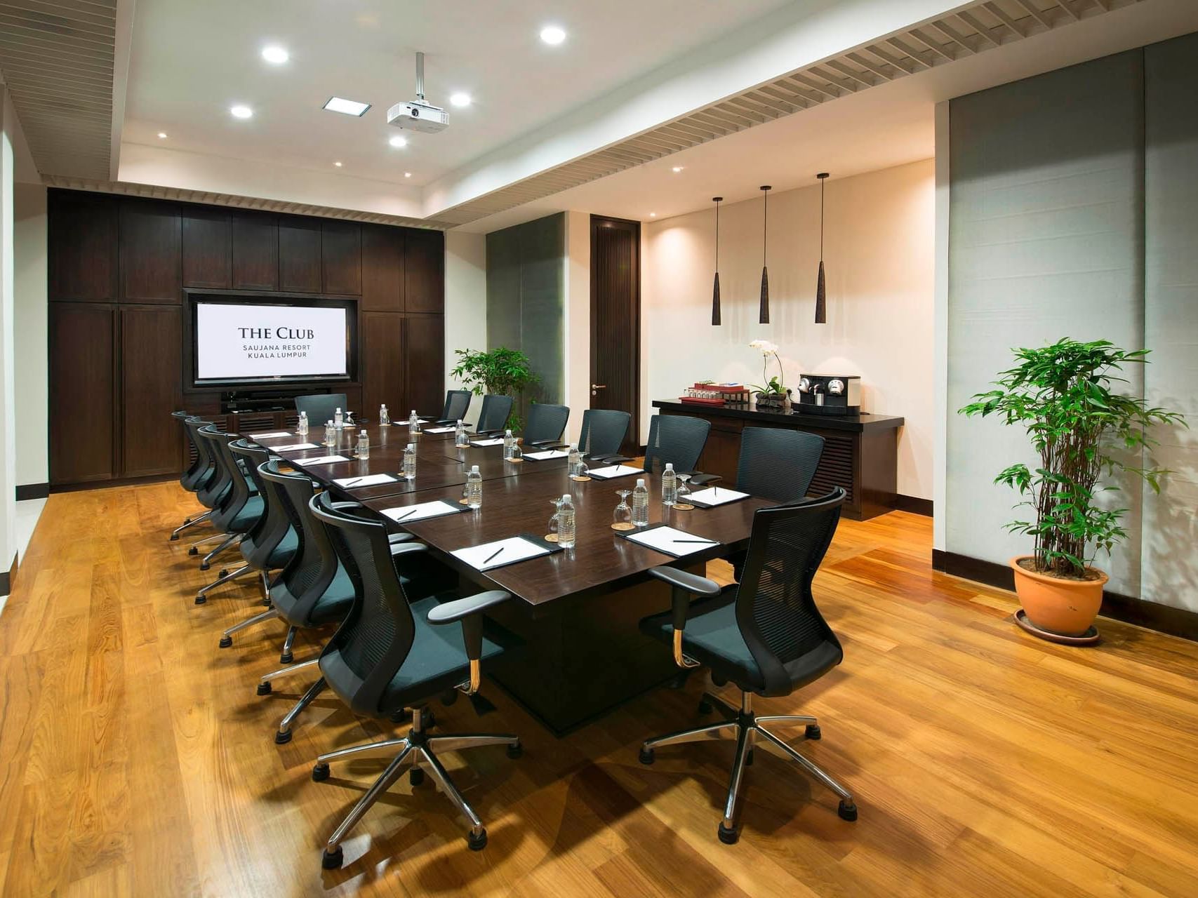 Interior of the table arrangement in Boardroom with wooden floors and refreshments corner at Saujana Hotel Kuala Lumpur